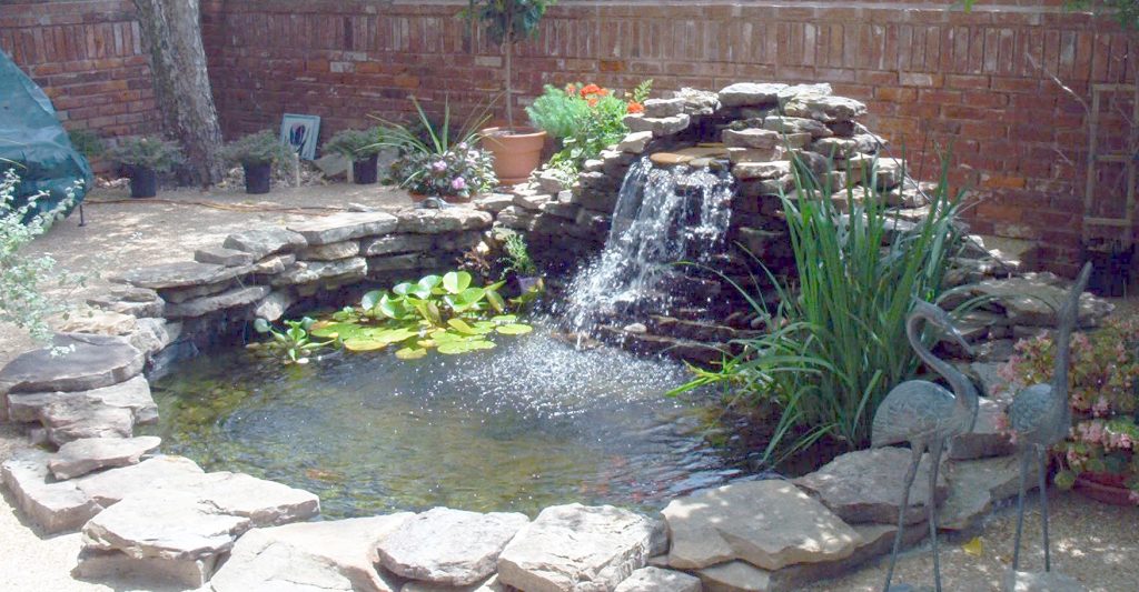 Decorative outdoor water feature with flowing water